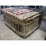Large wicker basket marked 'Supreme'