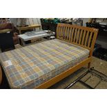 Wooden double bed with air sprung mattress