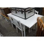 White wooden dining table with 4 matching chairs