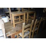 Old pitch pine kitchen table with set of 6 pine ladder back rush seat chairs