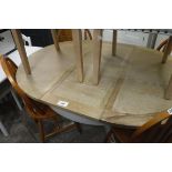 Oak extending dining table with grey support