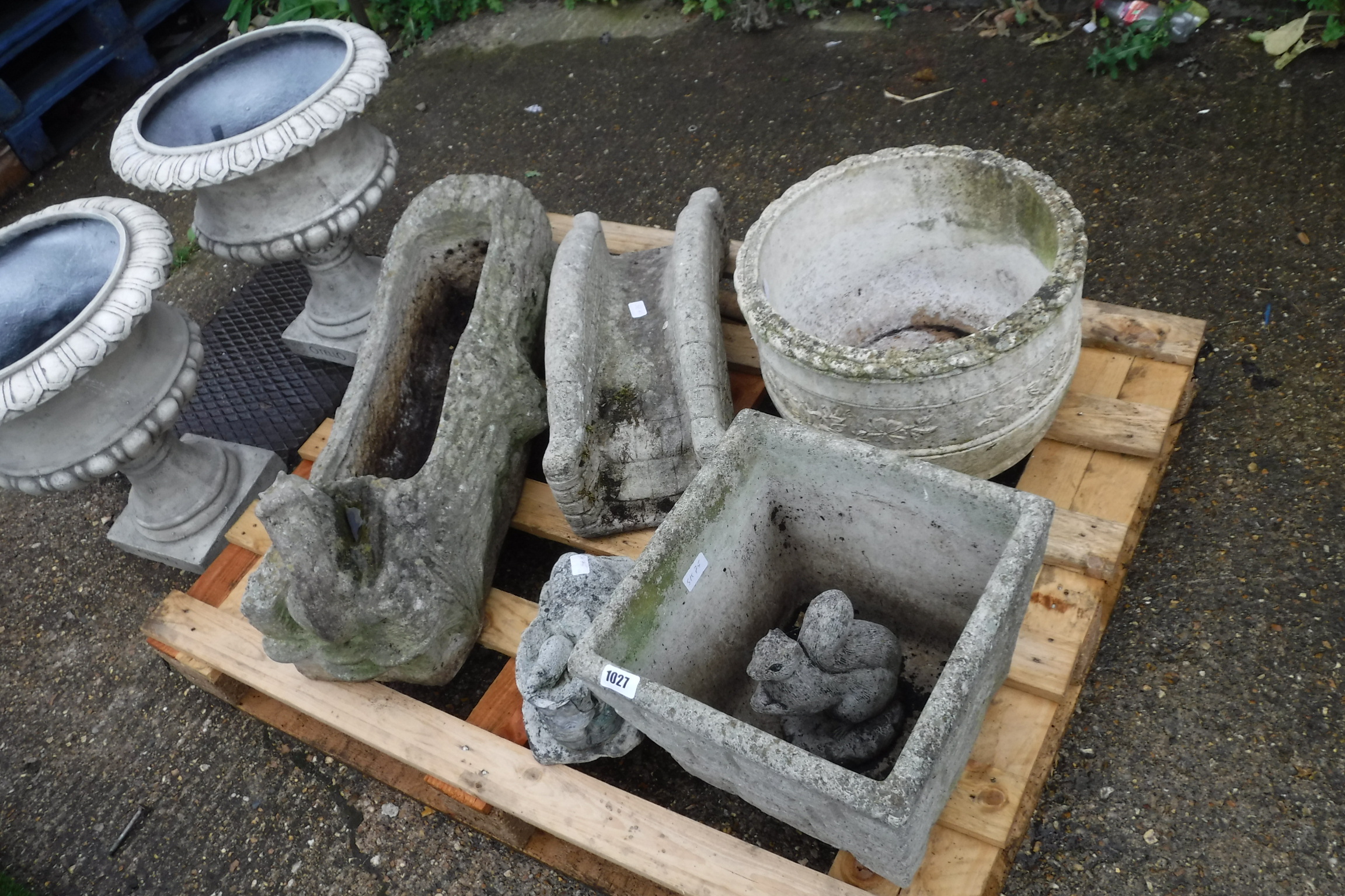 Pallet of various concrete ornaments and planters