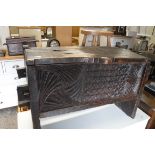 Carved panel lift top plank coffer