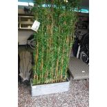 Artificial bamboo screen in slate pot (broken pot at back)