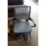 Grey swivel office armchair