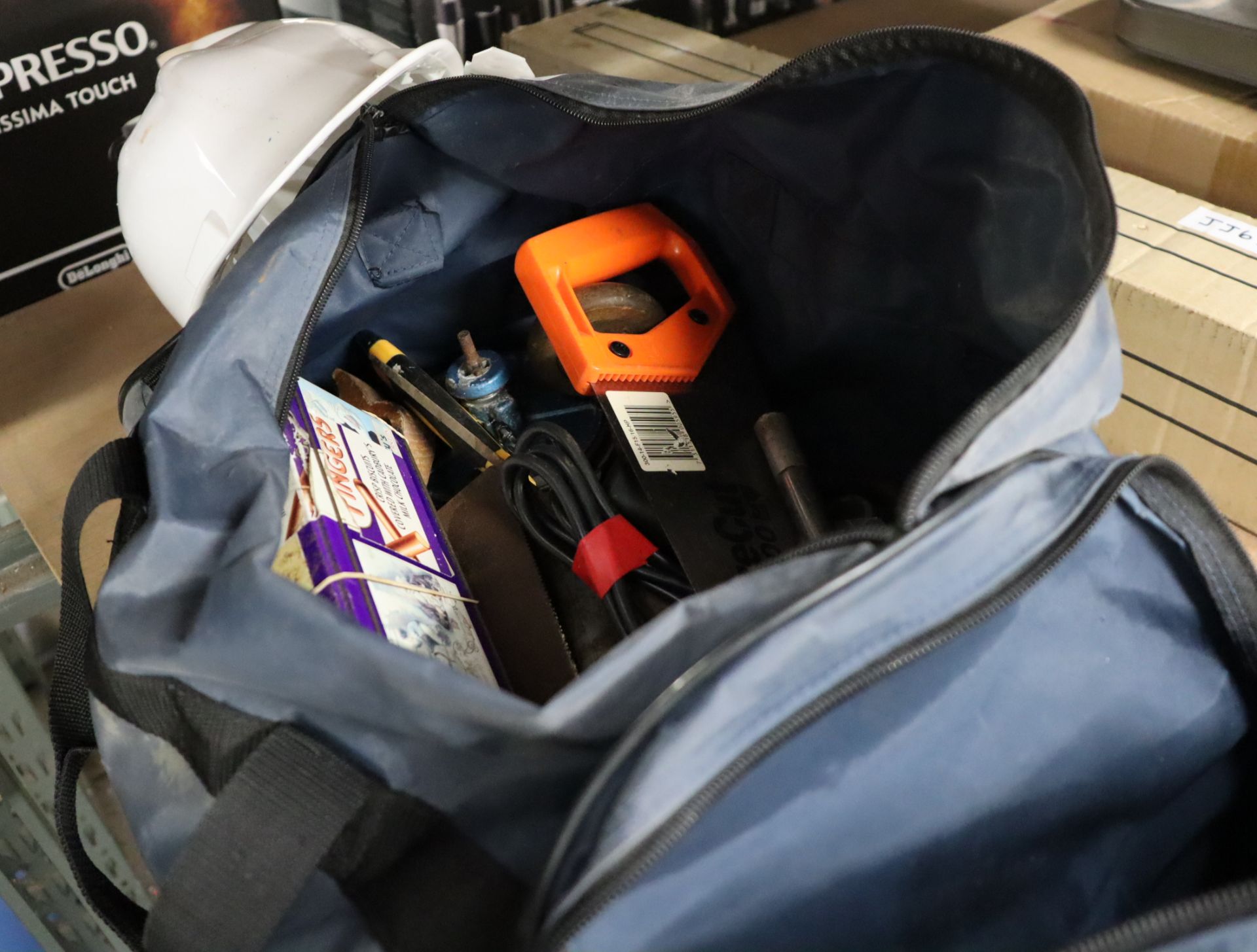 Grey tool bag containing mixed tooling