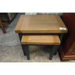 (1) Dark grey nest of 2 coffee tables with oak surfaces