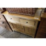 Modern light hardwood mini sideboard with 2 drawers over double door cupboard