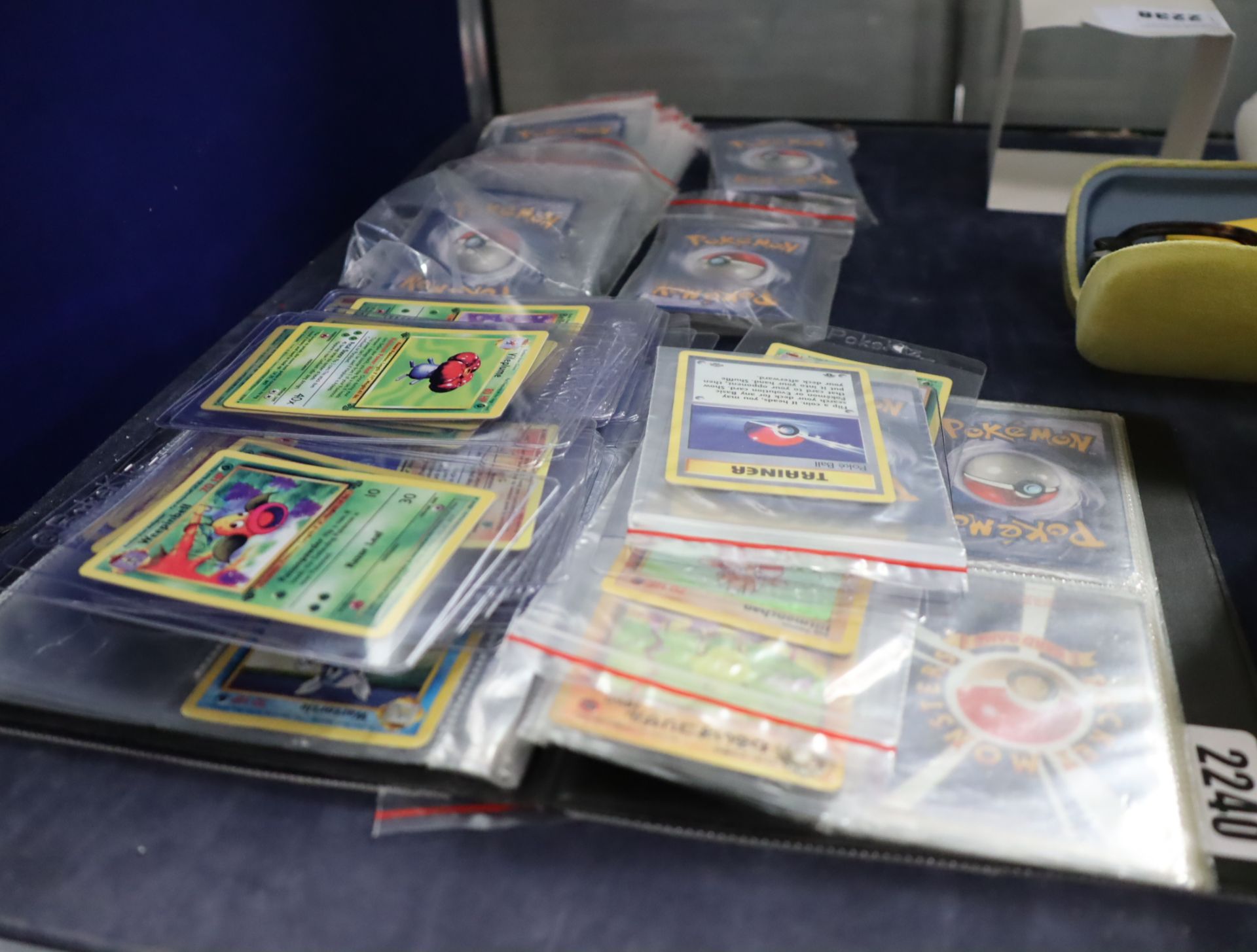 Collection of Pokemon cards, many in card protectors