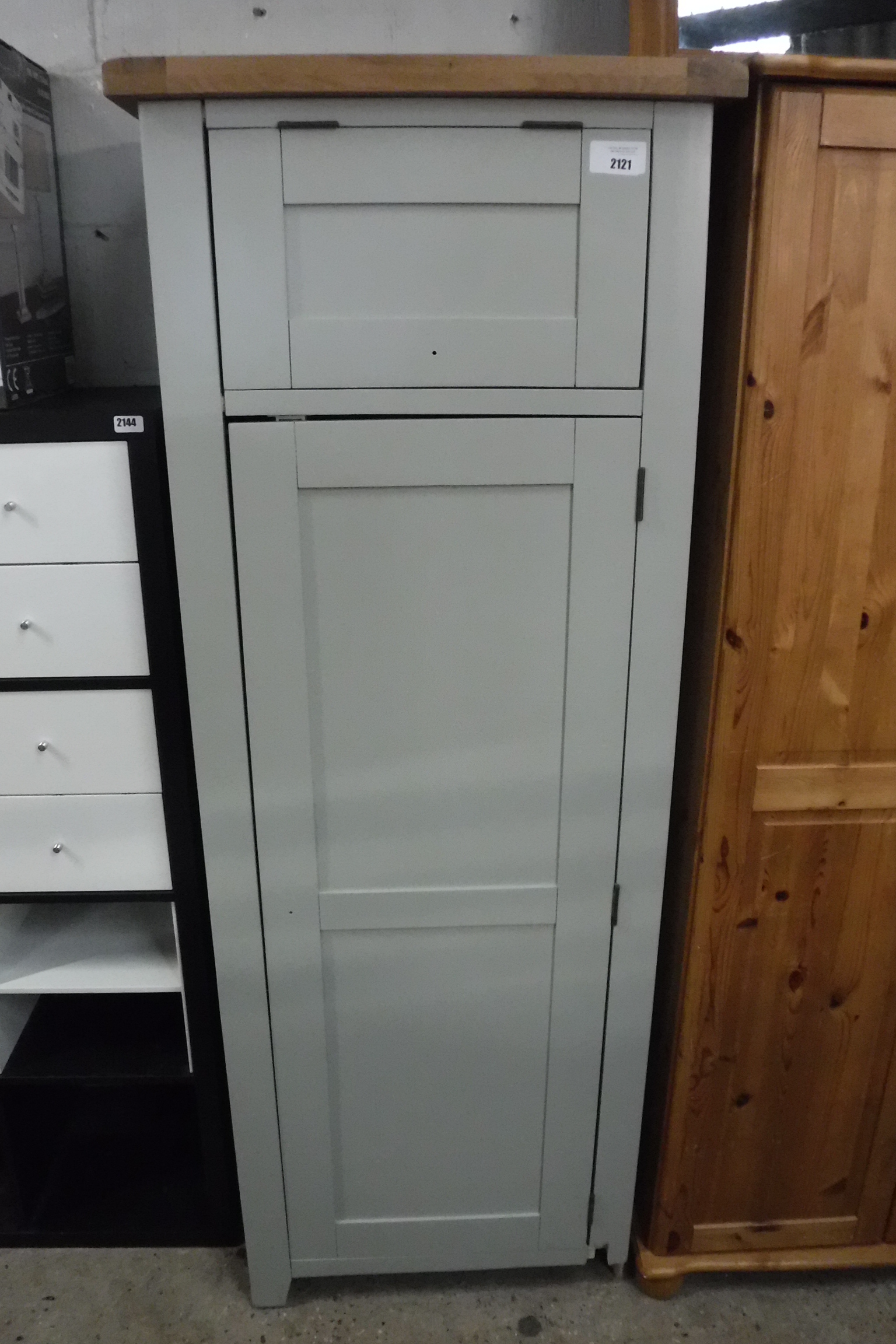 Green single door pantry cupboard with oak top