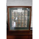 Framed and glazed players cigarette set depicting various regimental flags