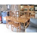 Ercol extending dining table with 5 matching spindle back chairs