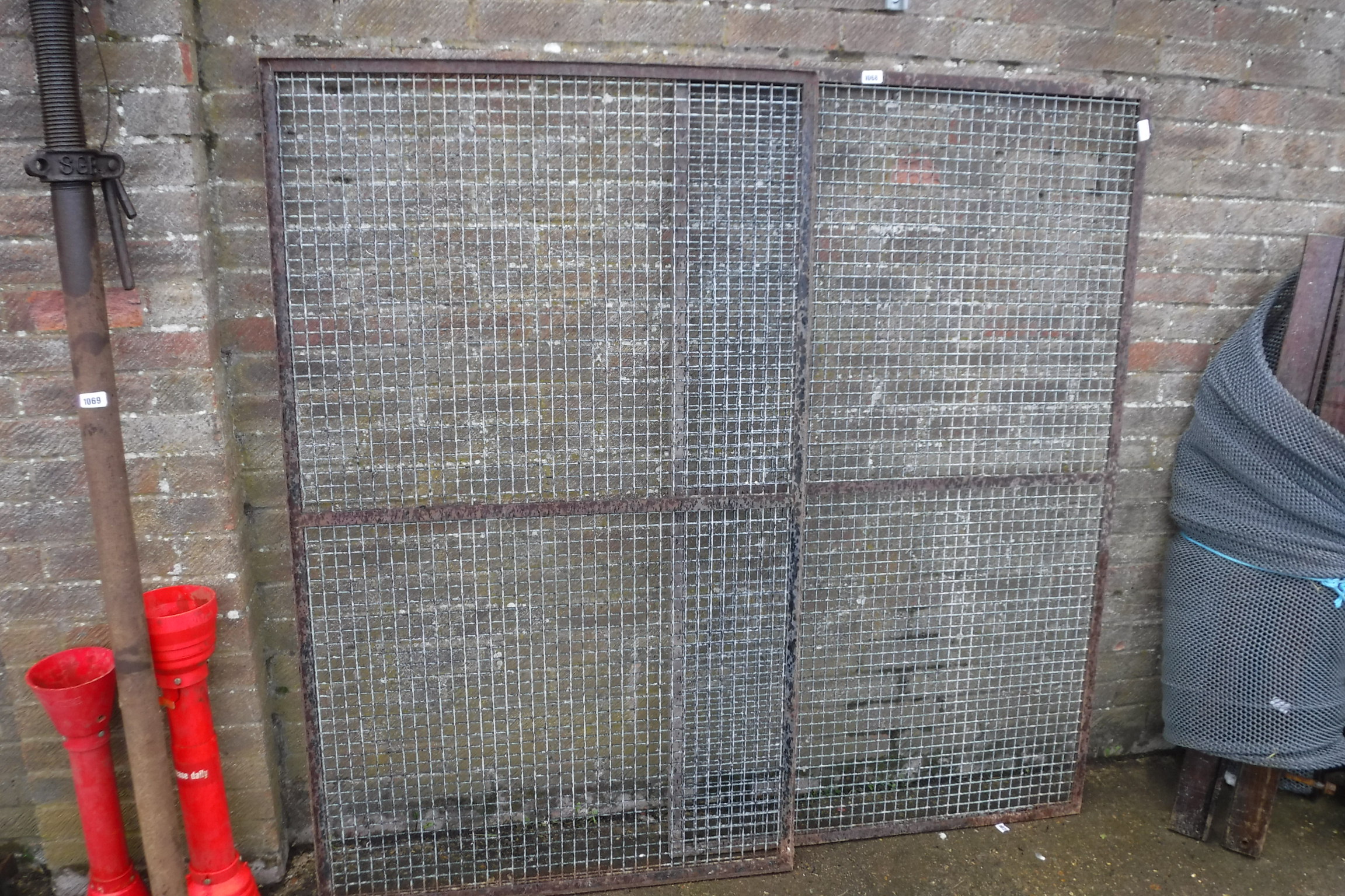 Pair of metal cage doors