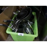 Crate of loose cooking pans