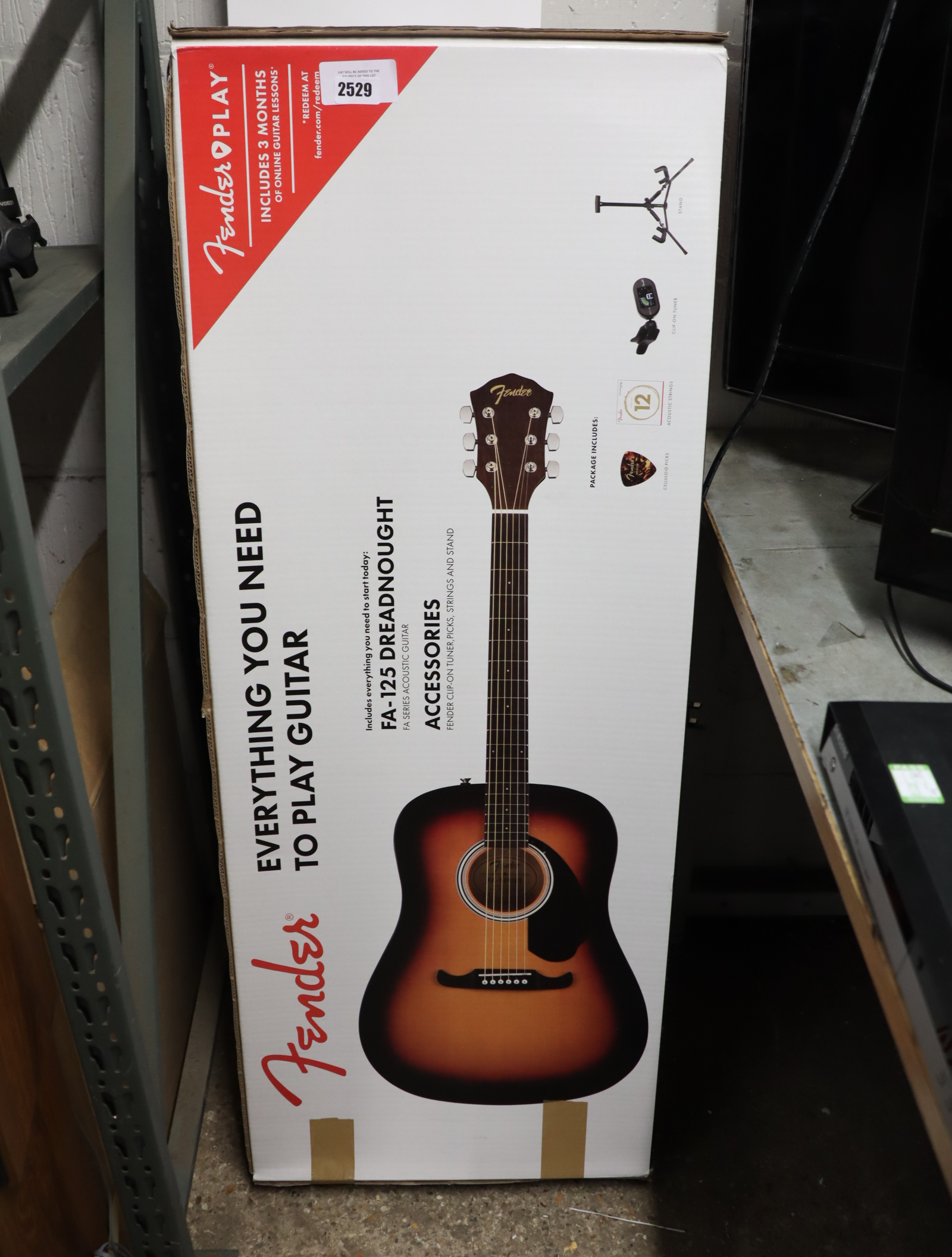 Boxed Fender acoustic guitar