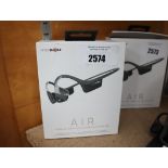 Pair of boxed Aftershokz Air wireless bone conduction headphones