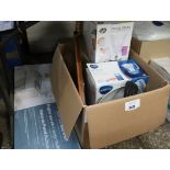 Box containing mixed kitchenware incl. Brita water filter, chopping board, serving utensils with a