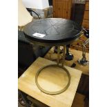 Circular metal side table with black wood effect surface