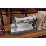 Jones electric powered sewing machine in case
