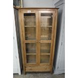 (36) Modern light oak display cabinet with single drawer to base