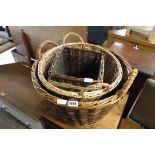 Graduated pair of wicker baskets and 2 wicker waste paper baskets