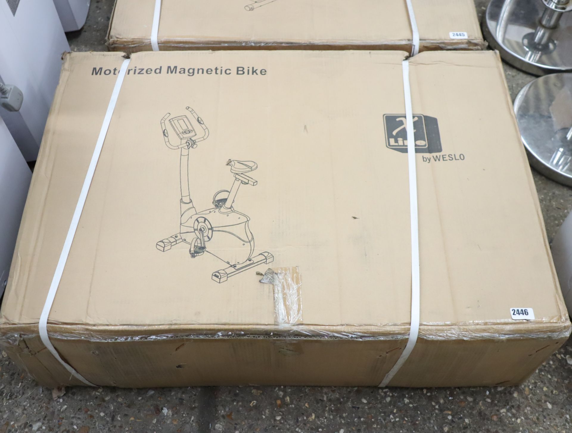 Boxed motorized magnetic exercise bike