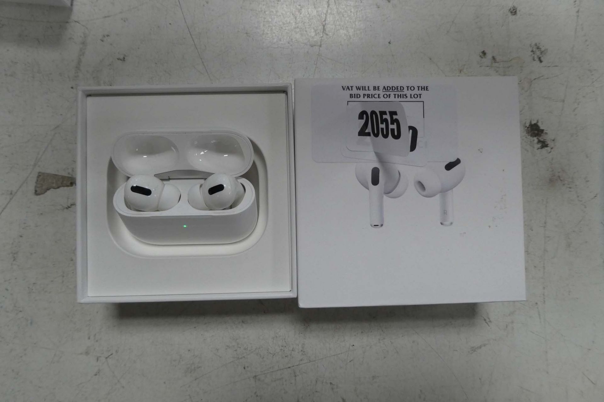 2100 Boxed pair of Apple AirPods Pro with wireless charging case and box