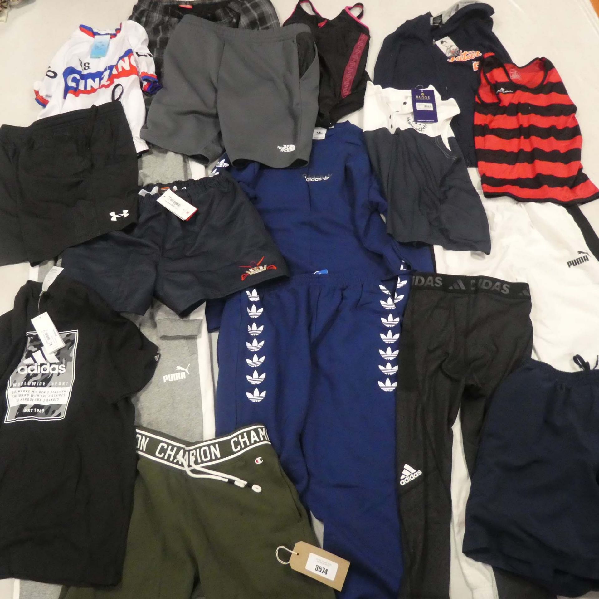 Bag containing sportswear, including Adidas, Puma, Champion, Underarmour etc