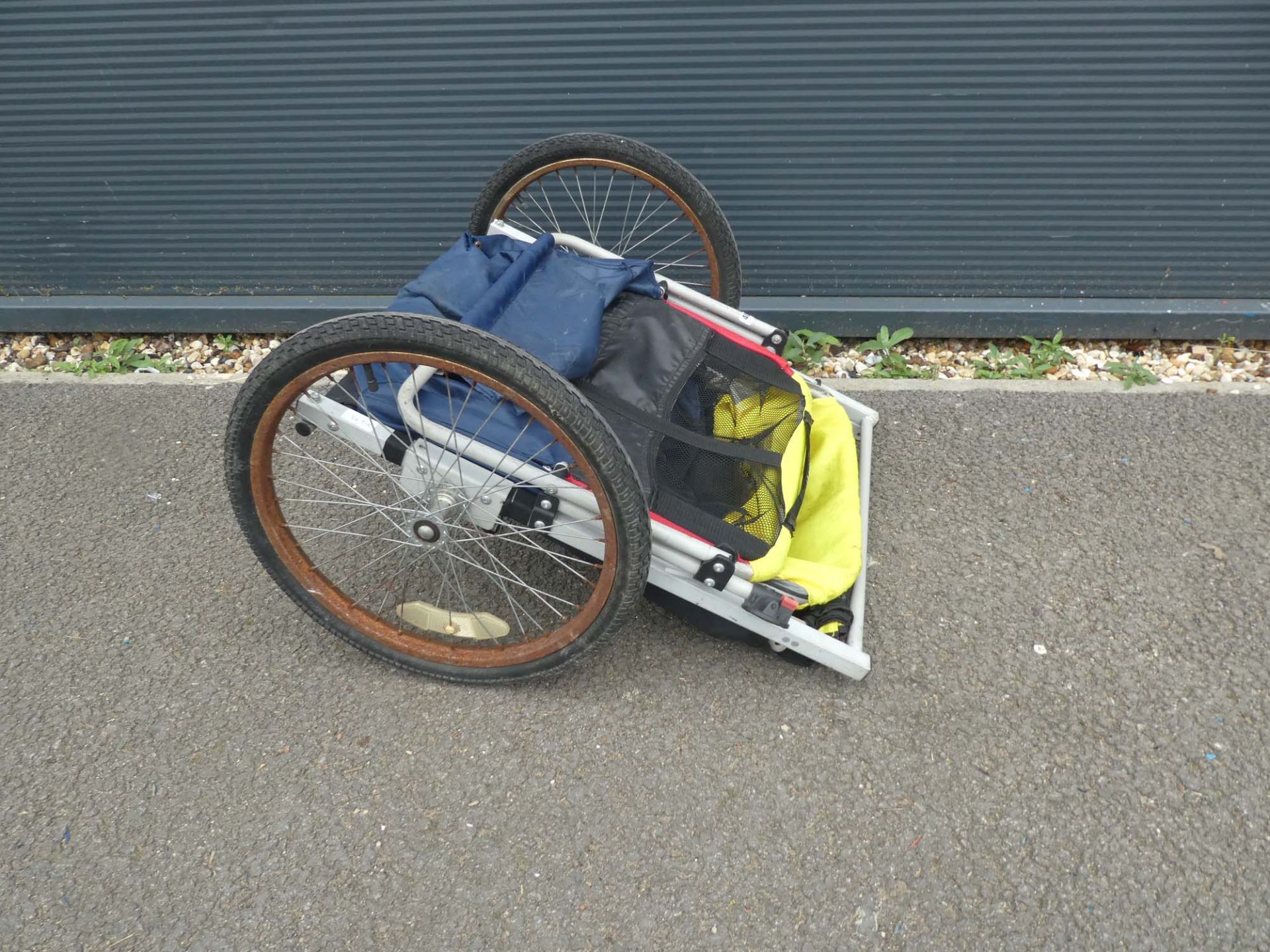 Bike trailer with yellow and blue canopy