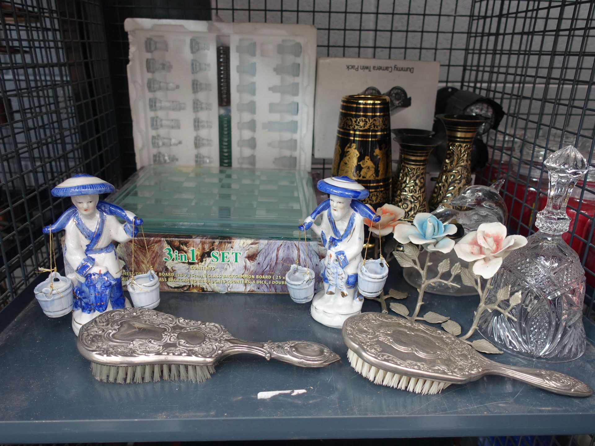 (1) Cage containing glass chessboard and pieces, hairbrushes, Oriental figures, glass dolphins, bell