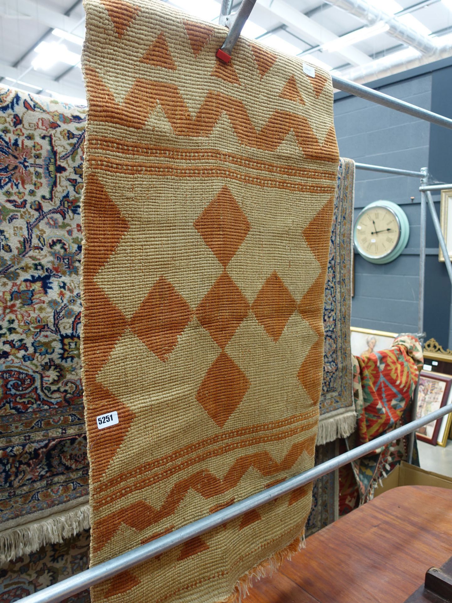 Terracotta and beige diamond patterned mat