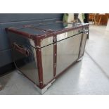 Metal and leatherbound trunk