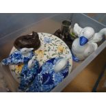 Box containing ornamental ducks and horses