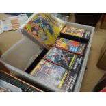 Box containing Transformers video cassettes and magazines