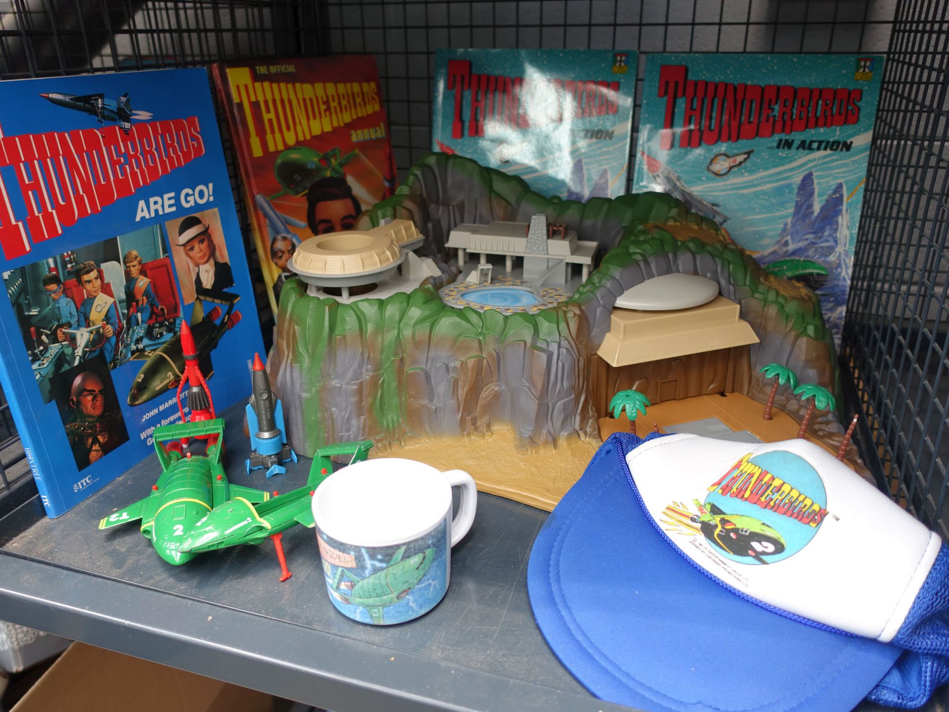 Matchbox Thunderbirds Tracy Island electronic playset, boxed, plus associated cap, mug and books