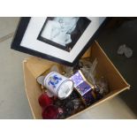 Box containing print of Marilyn Monroe, metal ornamental figures, red glass, glass ornaments and