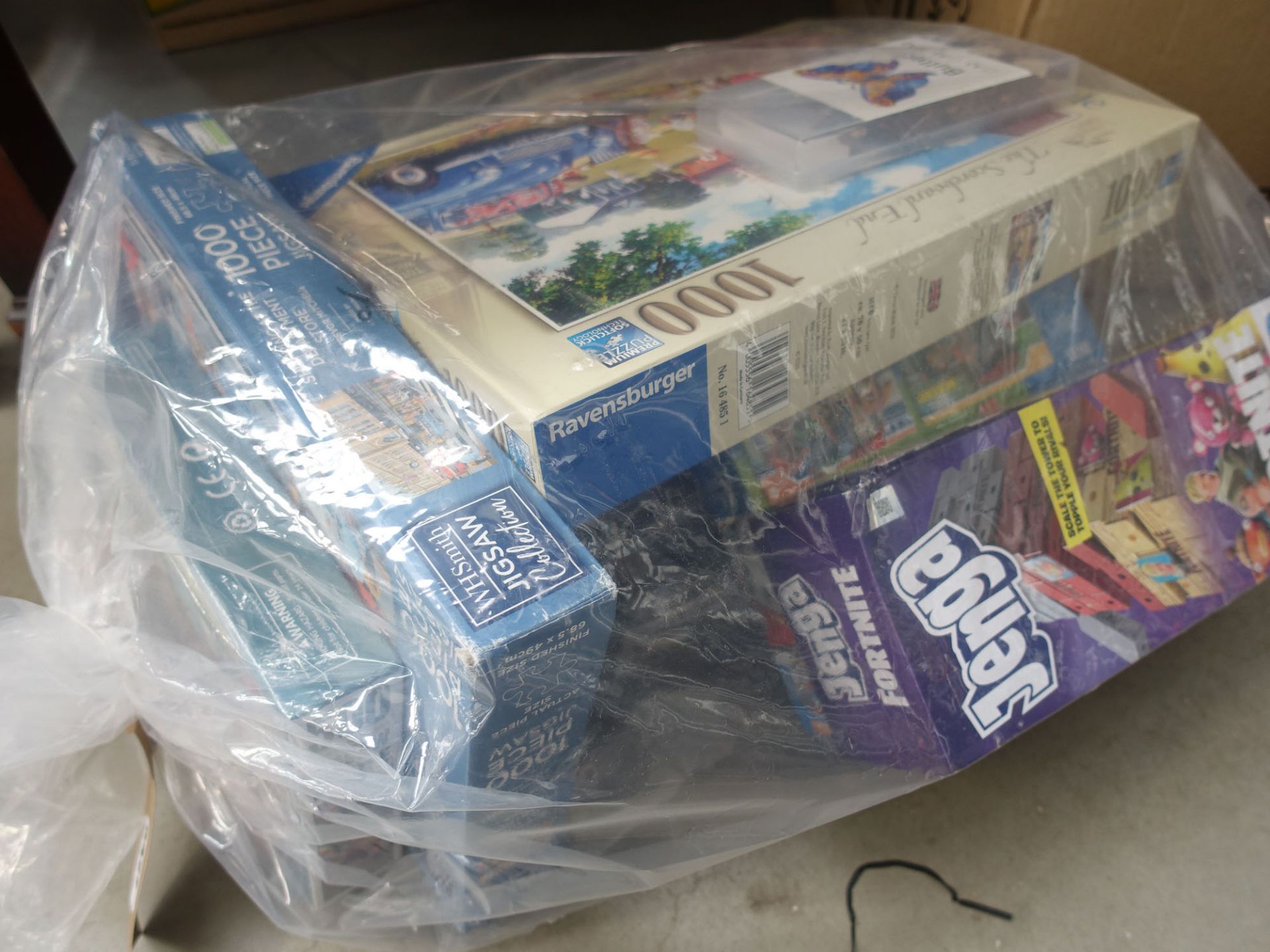 Bag containing jigsaw puzzles and board games