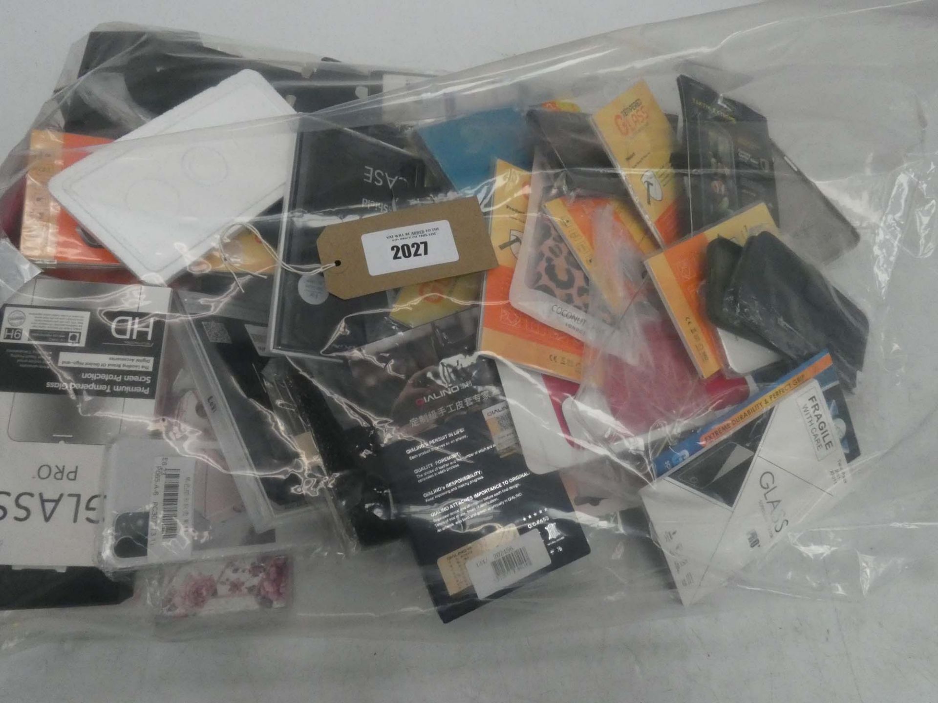 Bag containing quantity of mobile phone cases and covers