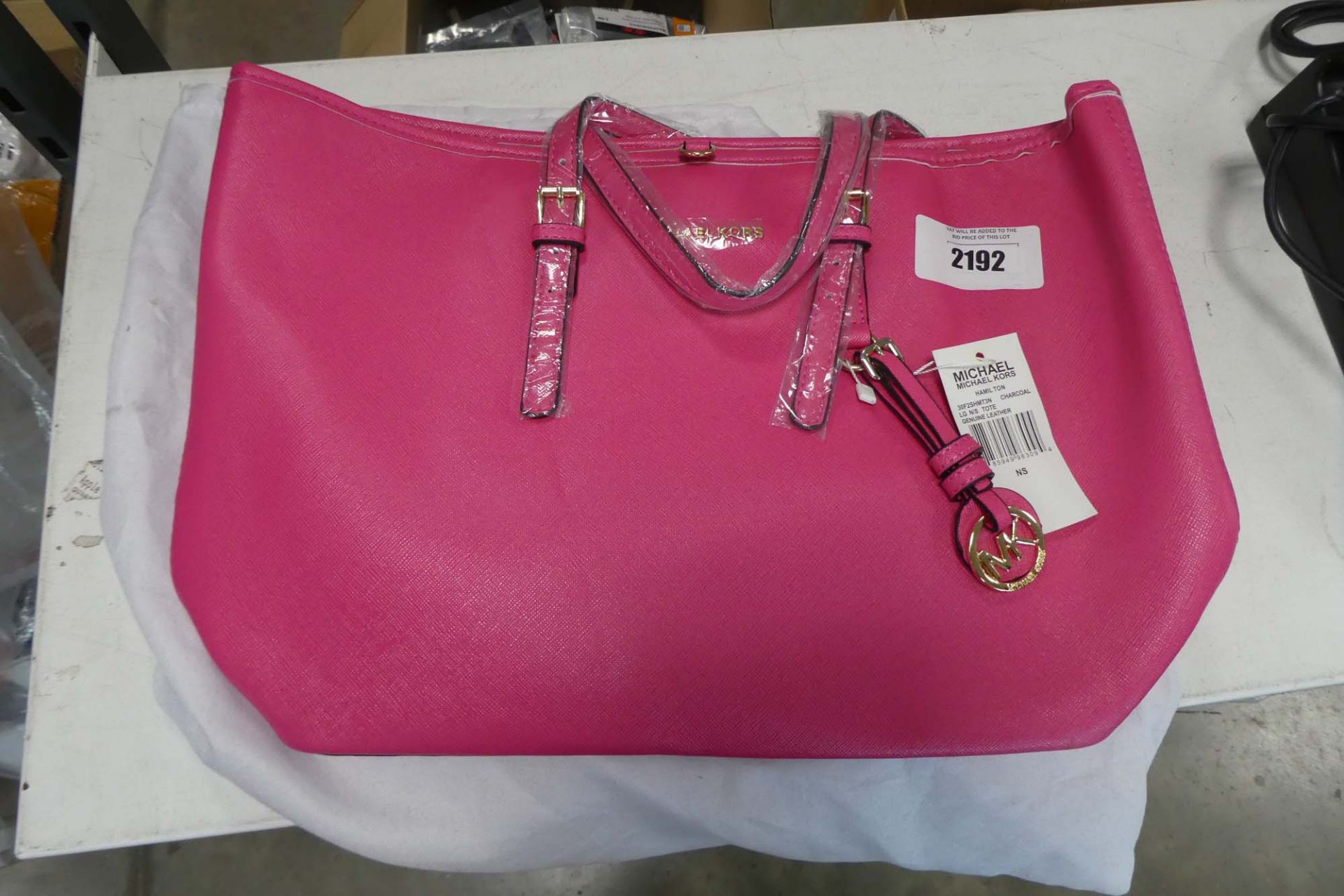 Pink Michael Kors bag with dust cover