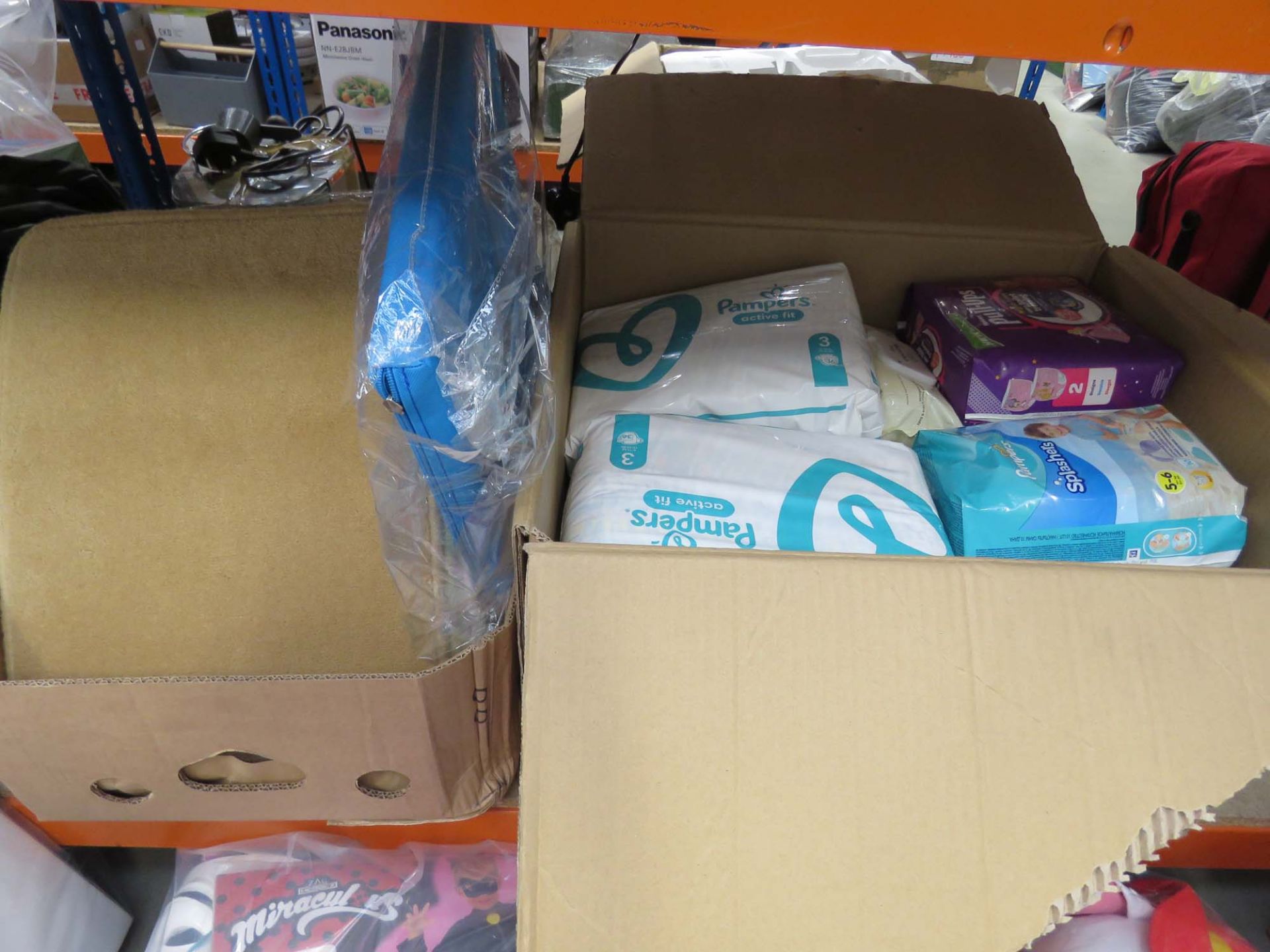 Box containing various wet wipes, Pampers, etc