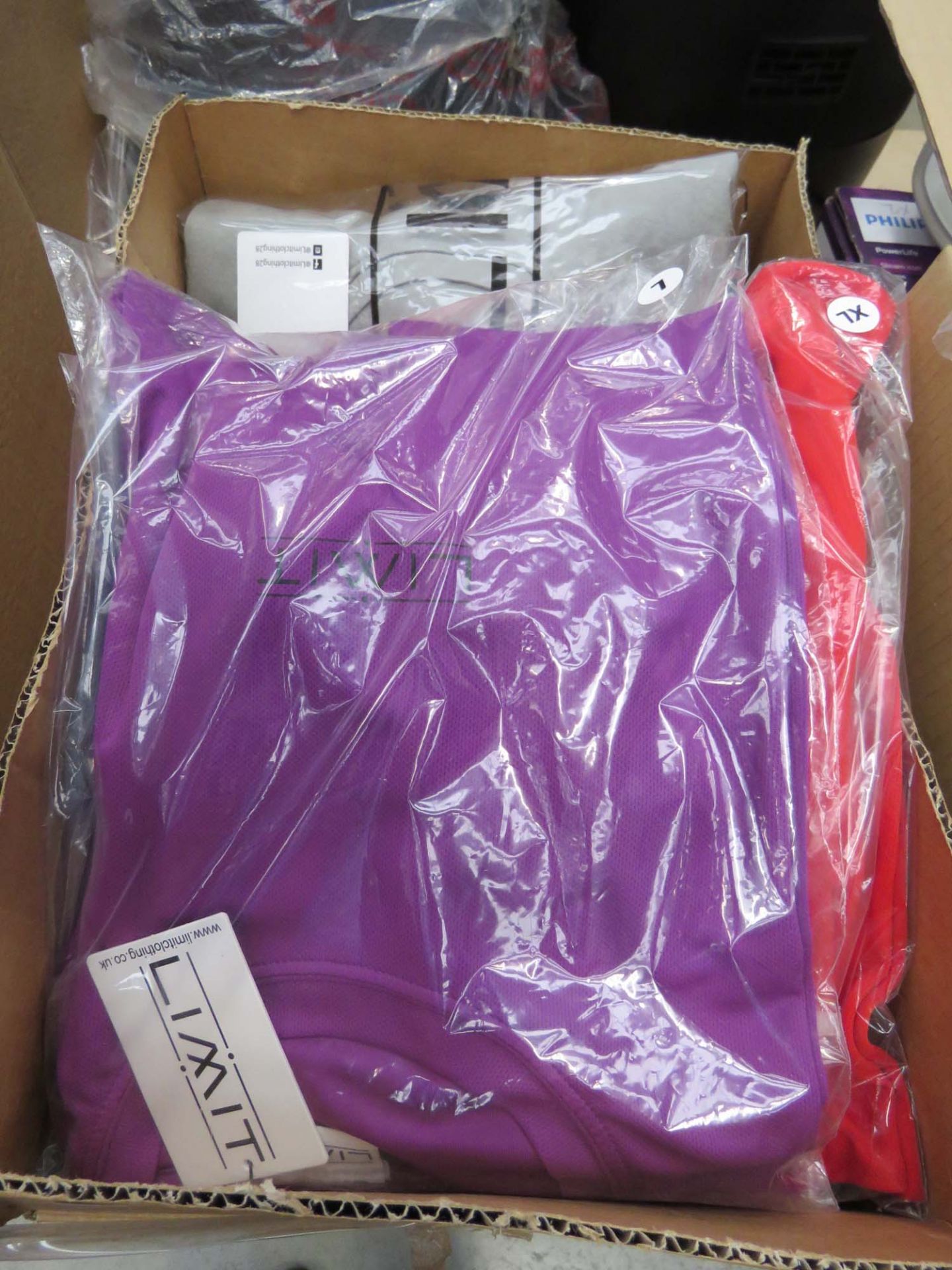 Box containing a qty of Limit clothing to inc. t shirts, trousers, etc