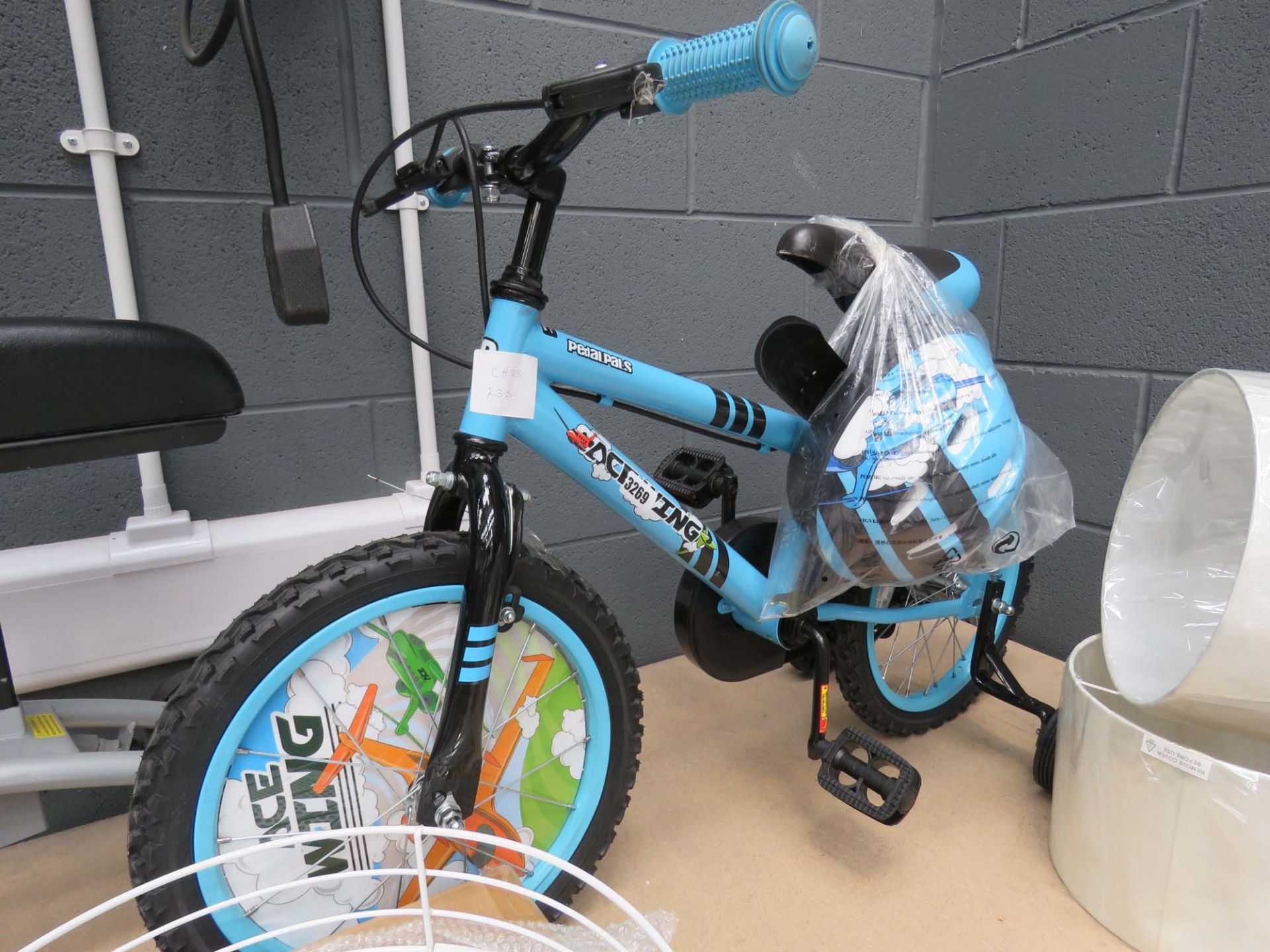 Child's Pedal Pals cycle with helmet