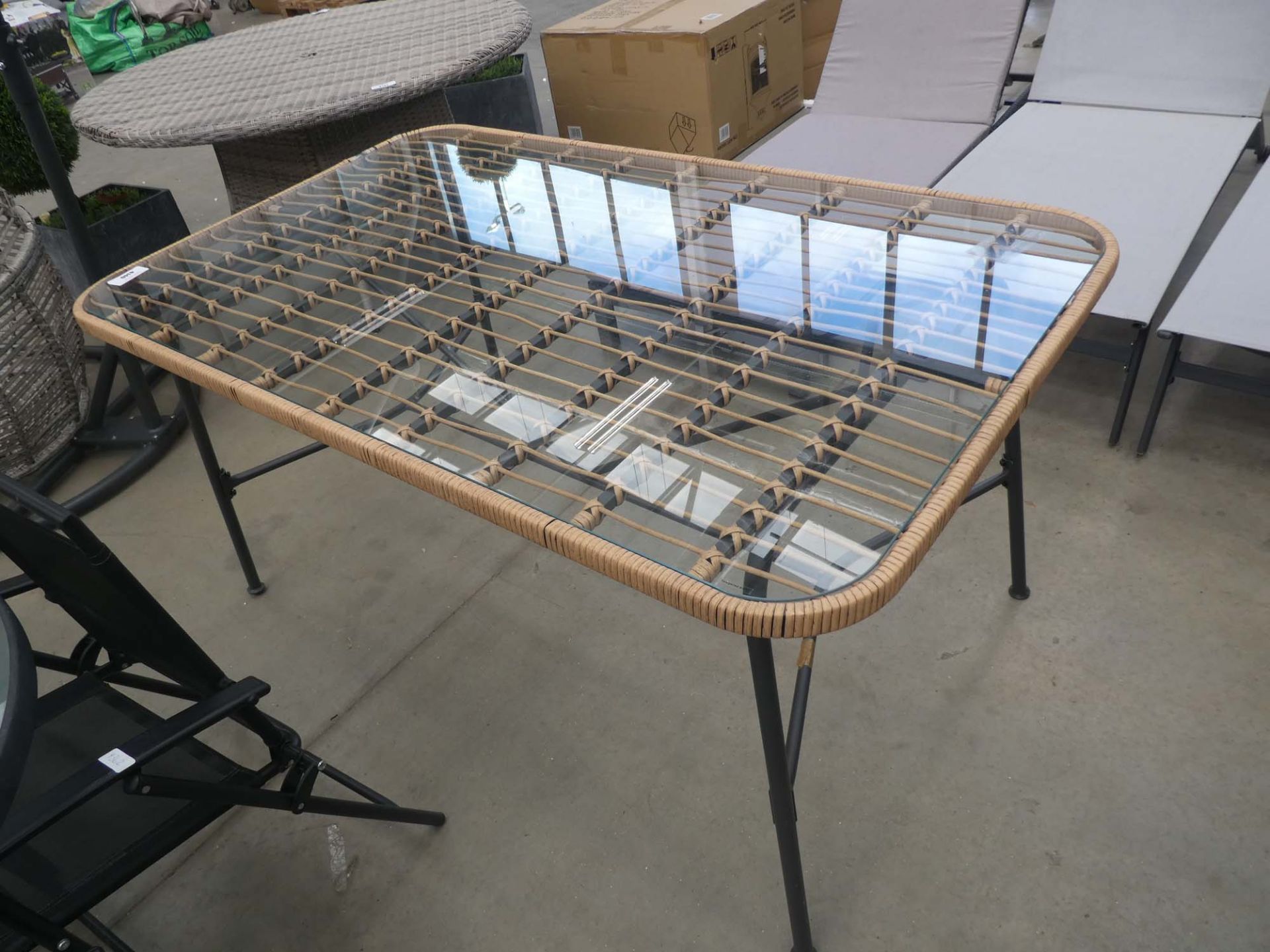 Rectangular glass topped garden table with metal base