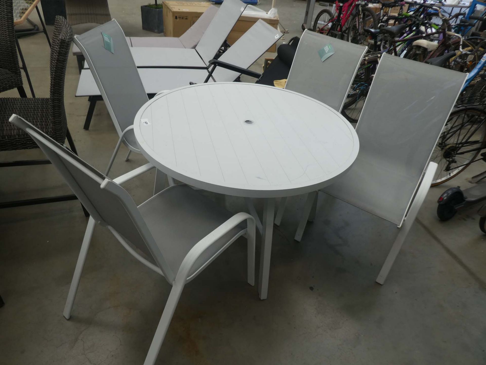 Round metal garden table with 4 matching chairs