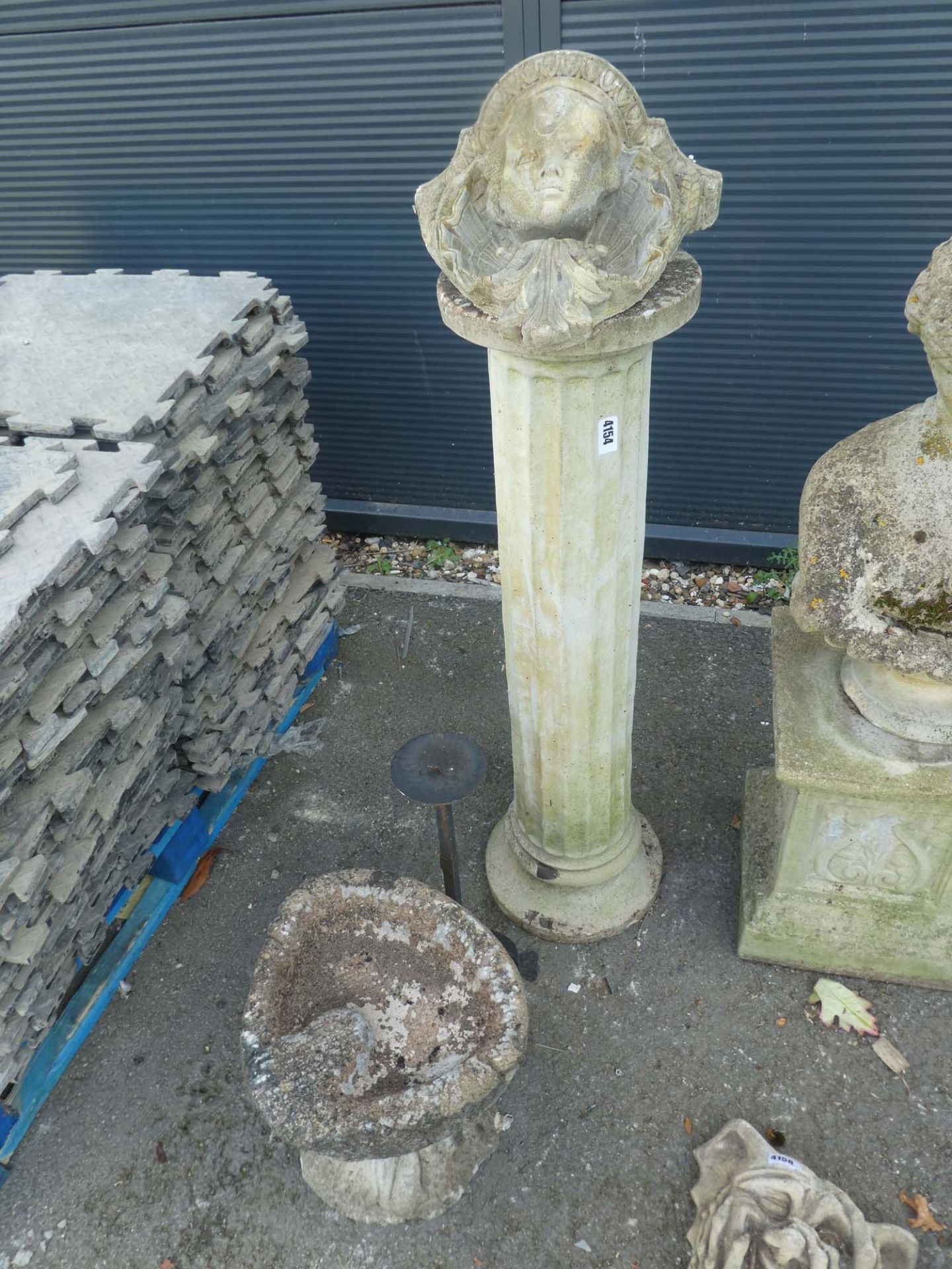 Concrete column, wall bracket, small bird bath and a metal plant stand