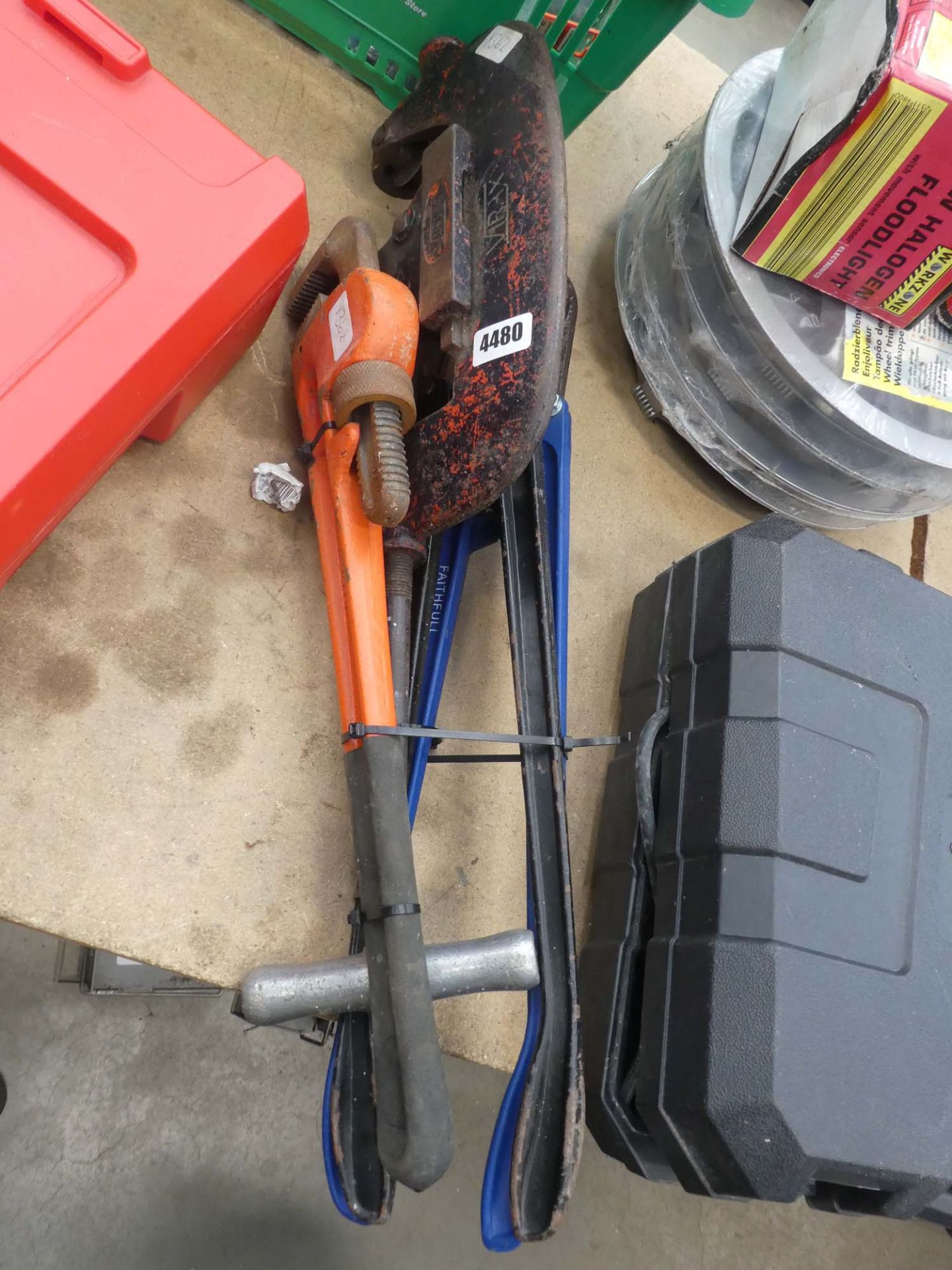 Pipe cutter, 2 bolt cutters, and pair of Stilsons