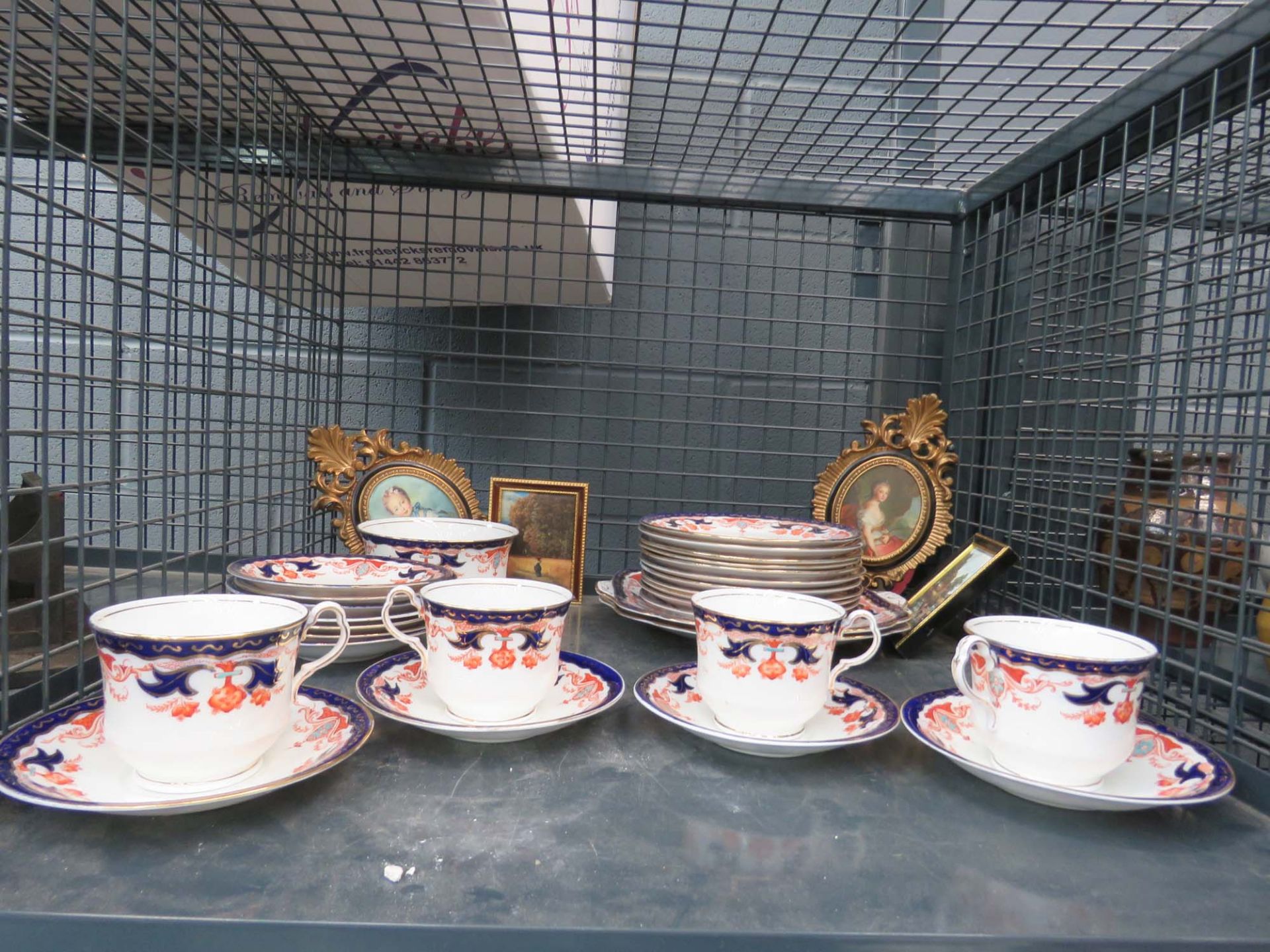 Cage containing floral patterned cups and saucers plus side plates and miniature portraits