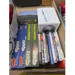 Box of DVDs and jigsaw puzzles