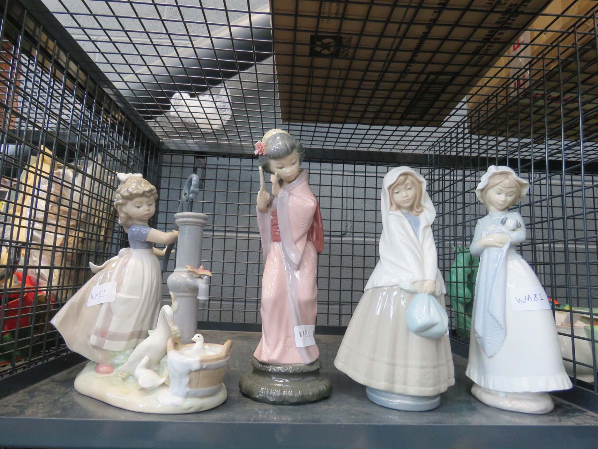 Cage containing a quantity of Nao and Lladro figures