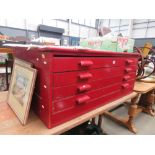 Red painted four drawer plans chest